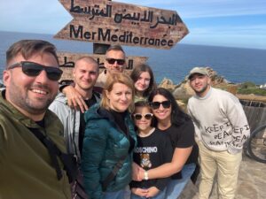 Omar and clients at the point where the Mediterranean meets the Atlantic