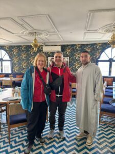 Omar and happy clients at a restaurant in Tangier