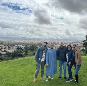 Omar and happy clients overlooking Moroccan city