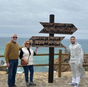 Omar and clients at the point where the Mediterranean meets the Atlantic